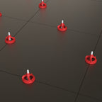 Twister PLUS tile levelling system in use on dark porcelain floor tiles - multiple