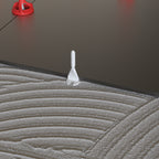 Twister PLUS tile levelling system in use on dark porcelain floor tiles - screw only
