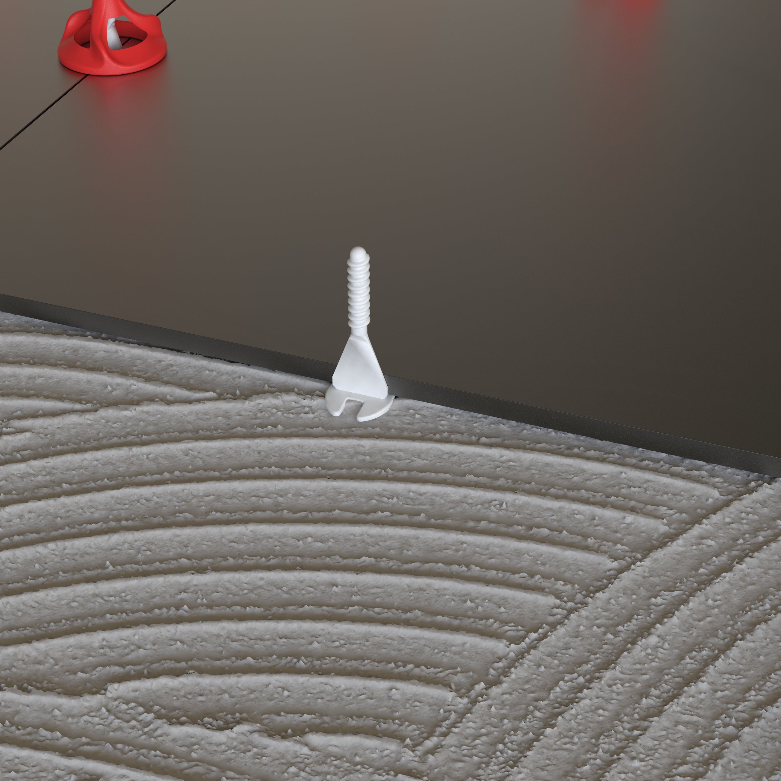 Twister PLUS tile levelling system in use on dark porcelain floor tiles - screw only