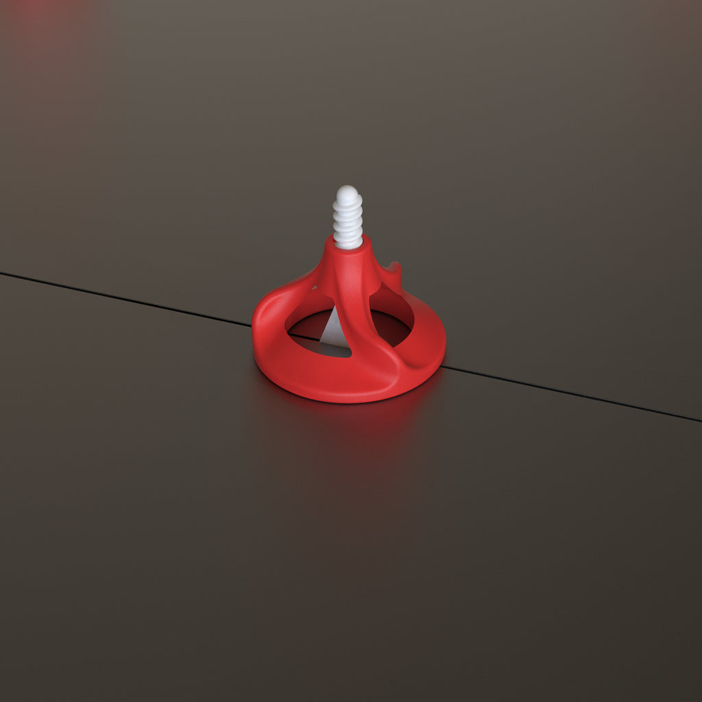 Twister PLUS tile levelling system in use on dark porcelain floor tiles - single